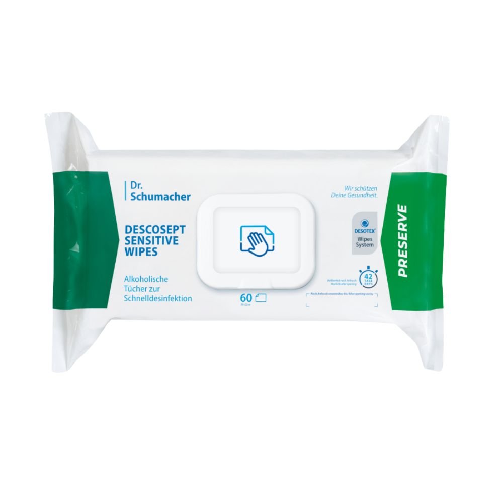 Un paquete de toallitas desinfectantes «Dr. Schumacher Descosept Sensitive Wipes» de la empresa Dr. Schumacher GmbH, destinadas a una desinfección rápida. La etiqueta indica que se trata de toallitas a base de alcohol, ideales para superficies de tamaño medio. El paquete es predominantemente blanco con detalles en verde y contiene 60 toallitas.