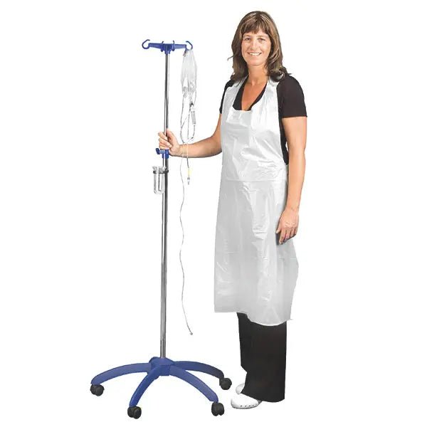 A woman in black clothing smiles while holding an IV pole. She is wearing the Altruan Clinhand women's disposable aprons, 120cm (50 pieces). The white disposable apron stands out against the plain background.