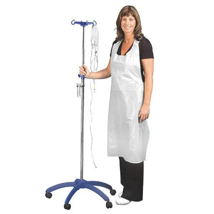 A woman in black clothing smiles while holding an IV pole. She is wearing the Altruan Clinhand women's disposable aprons, 120cm (50 pieces). The white disposable apron stands out against the plain background.