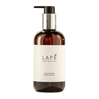 The LAPE Earth Collection Sakura Sea Breeze Hand & Body Lotion (300 ml) by Diversey Deutschland GmbH & Co. OHG comes in a minimalist brown pump bottle with an elegant silver-and-black dispenser and features a fresh, floral scent for daily care.