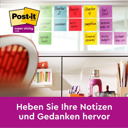 A desk with office chair, colorful Post-it® Super Sticky Notes from 3M Deutschland GmbH (76x127mm, 90 sheets/block, 16 blocks/pack, 100% PEFC) organized on a glass wall. Below it says: "Highlight your notes and thoughts."