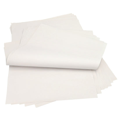 A stack of PAPSTAR 10 kg wrapping papers, made from 100% white cellulose from PAPSTAR GmbH, with some slightly raised or folded sheets, arranged on a flat surface.