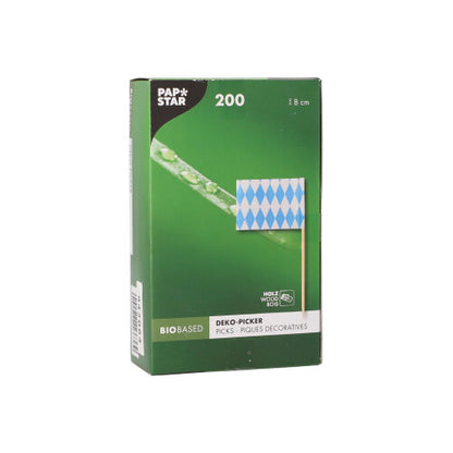 A green box from PAPSTAR GmbH with the label “PAPSTAR 200 decoration picks 8 cm” contains bio-based picks, each with a blue and white diamond flag – perfect for finger food presentation. The packaging contains multilingual product details.
