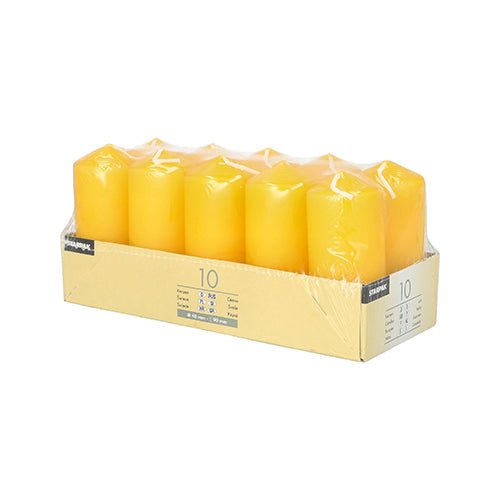 A pack of ten Starpak 10 pillar candles (Ø 40 mm · 90 mm), arranged in two rows and wrapped in clear plastic on a beige tray with a label—ideal for weddings or for creating a cozy atmosphere.