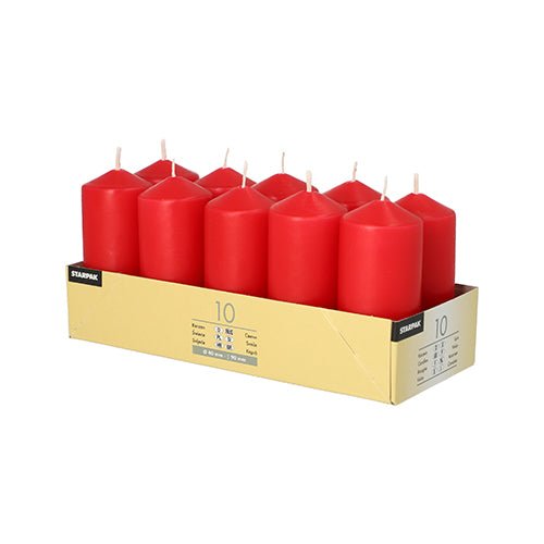 A cardboard tray holds 10 upright Starpak pillar candles (Ø 40 mm × 90 mm) arranged in two rows of five, each with a white wick. The tray features the Starpak branding and product information—ideal for creating a romantic atmosphere against a white background.