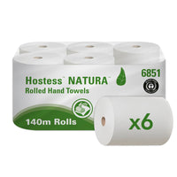 A box containing six Hostess™ NATURA roll towels from Kimberly-Clark GmbH—each roll 140 m long and natural in color—features eco-friendly white and green packaging with the product name, the leaf logo, and a six-roll symbol—ideal for sustainable needs.