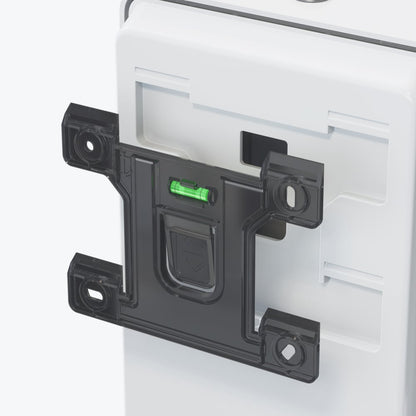 A close-up of the black holder with green level attached to the white Kimberly-Clark Professional™ Icon™ Electronic Skincare Dispenser (1.2 L, touchless dispensing, White Mosaic) for precise alignment and improved hygiene.