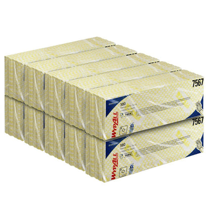 En stor stabel med WypAll® X80 Critical Clean - Interfold rengjøringskluter (41,00 x 33,00 cm) fra Kimberly-Clark GmbH, artikkel 7567, i gule, hvite og blå esker - ideelle rengjøringskluter for kritiske miljøer.