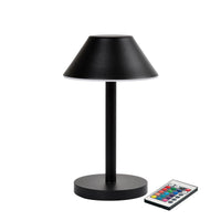 The Zelda Midi LED lamp from Duni GmbH, featuring a modern graphite design with a round base and a conical shade, is paired with a remote control with colorful buttons—the ideal, energy-efficient lighting solution.