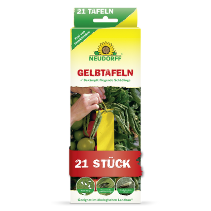 Eine rechteckige Schachtel von Neudorff Shop Gelbtafeln (kleinformatig) zeigt eine Hand, die eine gelbe Klebefalle zwischen Tomaten platziert. Die 21-teilige Packung kontrolliert Weiße Fliegen und Trauermücken und ist für den ökologischen Landbau geeignet.