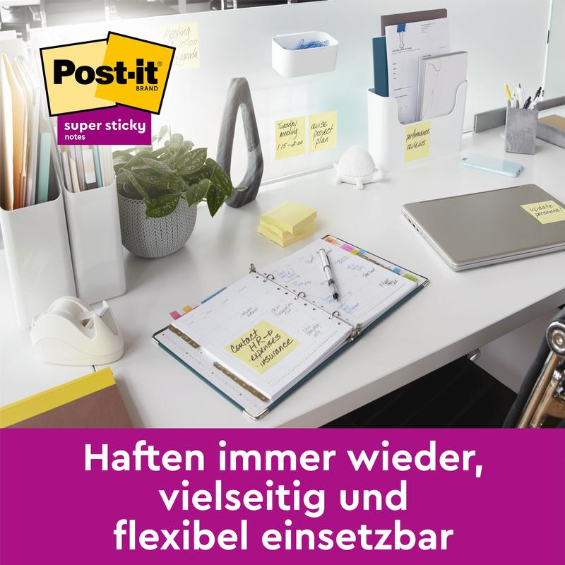 A modern desk with a laptop, planner, and supplies - all marked with 3M Deutschland GmbH Post-it® Super Sticky Notes Cube, Yellow (76 x 76 mm). Text below: "Stick again and again, versatile and flexible to use.