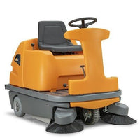 The TASKI balimat 6500 RTU from Diversey is a battery-powered, rugged ride-on vacuum sweeper with 2 roller brushes, side brushes, 4x180 Ah batteries, and a charger—ideal for efficiently cleaning large areas.