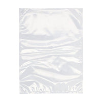 Una bolsa con borde sellado Starpak 100, de PA/PE transparente, de la marca Starpak, aparece extendida sobre un fondo blanco. Esta bolsa lisa y ligeramente arrugada es ideal para las máquinas de vacío de cámara, ya que permite conservar la frescura de los alimentos.