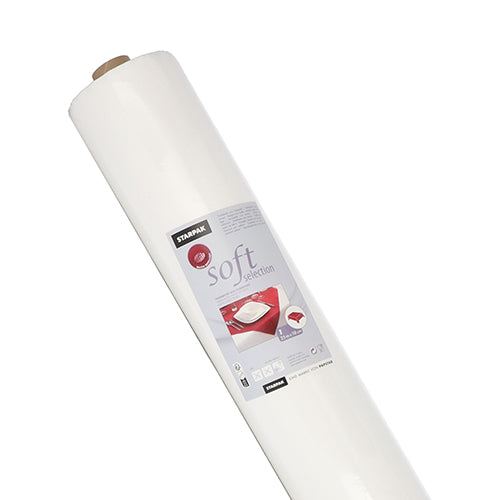 Se muestra un gran rollo de mantel Starpak, similar a tela, fieltro "soft selection" (25 m x 1,18 m, blanco) con una etiqueta con un símbolo de cojín y detalles del producto, fotografiado frente a un fondo blanco sencillo.