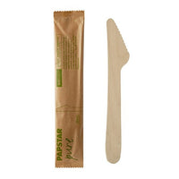The image shows a PAPSTAR "Pure" wooden knife, 16.5 cm, and the matching labeled paper packaging | Individually wrapped in shrink wrap (50 pieces) from PAPSTAR GmbH on a white background. The packaging features green and black lettering.