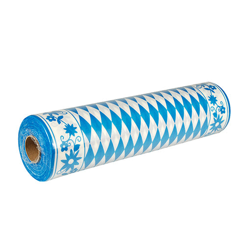 En delvis utpakket PAPSTAR bordløper Airlaid "Bayrisch Blau" (24 m x 40 cm), stofflignende, med blå-hvitt diamantmønster og blomsterkantdesign - ideell for en sjarmerende borddekorasjon i bayersk stil. Merke: PAPSTAR GmbH.