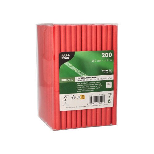 A clear plastic box containing 200 red PAPSTAR Cocktail straws (paper straws, Ø7 mm, 15 cm) from the PAPSTAR GmbH, with a green-and-white label featuring product information, a barcode, and "Cocktail Straws"—an eco-friendly choice for your drinks.
