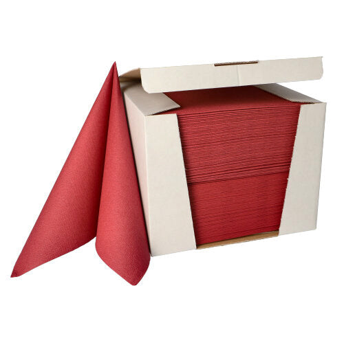 Ein Stapel PAPSTAR 100 Servietten „ROYAL Collection“ 1/4-Falz 40 cm x 40 cm der PAPSTAR GmbH wird teilweise aus einem offenen weißen Spenderkarton herausgezogen.