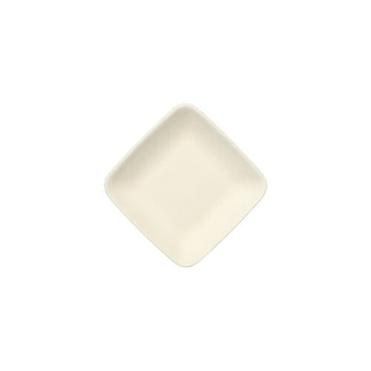 The PAPSTAR finger food plate square made of sugarcane "pure", 6.5 cm, white (12 pieces), is placed diagonally on a white background - a sustainable choice for disposable tableware or as a finger food plate.