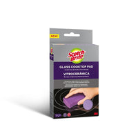 The image shows a package of Scotch-Brite™ glass-ceramic cleaning sponges (1 piece) from 3M Deutschland GmbH. The packaging, which is mostly purple-gray, features product information in English and Spanish, as well as an illustration of a hand cleaning a glass-ceramic cooktop.