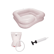 The discontinued item: AMPri washbasin with shower device and pump, inflatable by AMPri Handelsgesellschaft mbH with hand pump and water bag is presented for hair washing while lying down on a white background.