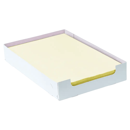 A stack of yellow sheets of stationery lies neatly in an AMPri Dental crepe pad tray filter box, which has a light pink hue on the inside and stands out against a pristine white background.