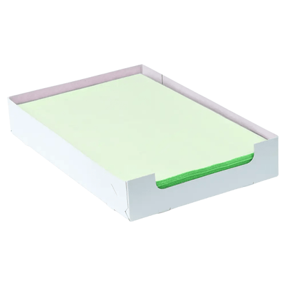 A neat stack of light green AMPri Dental crepe-lined tray filter papers, measuring 18 x 28 cm, lies in an open white cardboard box. The low side walls of the box, manufactured by AMPri Handelsgesellschaft mbH, allow for easy access to the top sheets.