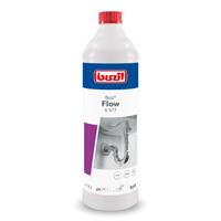 Una botella de 1 litro de desatascador líquido Buzil Buz® Flow G 577, fabricado por BUZIL-WERK Wagner GmbH & Co. KG. La etiqueta muestra un dibujo de un sanitario y el logotipo del producto. La botella, predominantemente blanca, está realzada con detalles en rojo, azul y violeta, y cuenta con un tapón rojo que sirve para eliminar eficazmente las obstrucciones en los desagües.