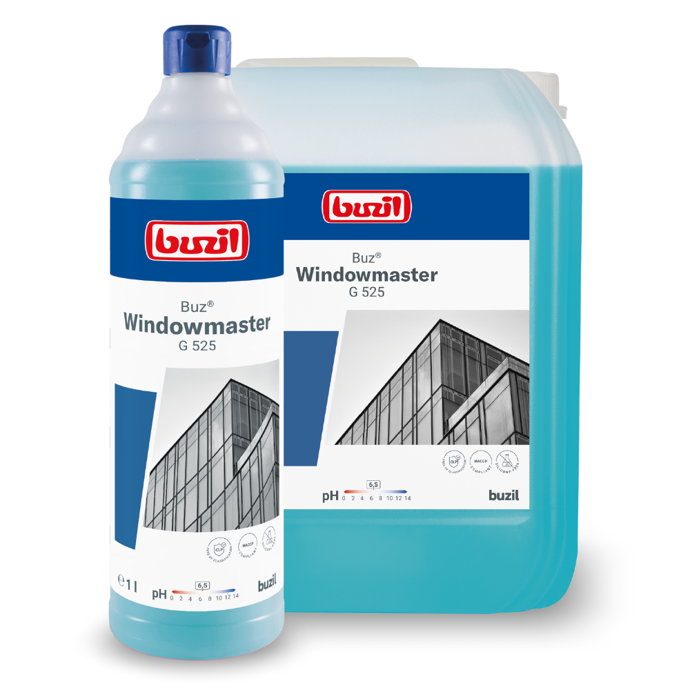 A bottle and a large container of Buzil Buz® Windowmaster G 525 glass and window cleaner concentrate from BUZIL-WERK Wagner GmbH & Co. KG are characterized by a fast-drying formula. The labels show a building facade with windows and indicate a pH value of 9.5. Both are filled with blue liquid that promises an enhanced anti-soiling effect.