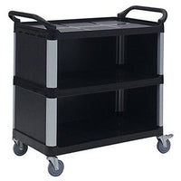 A black Novocal multipurpose plastic cart with three closed plastic shelves, silver uprights, raised handles at both ends, and four swivel casters. The empty cart is photographed against a white background.