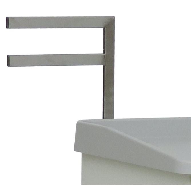 A close-up of the Novocal F-Bracket (330 mm), a metallic towel holder with two horizontal bars, mounted on the left side of a white rectangular cabinet. Brand: Novocal.