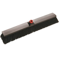 The Haug Bürsten The IN-UP LARGE-AREA BROOM features stiff 0.60 mm-thick polyester bristles, a black broom head measuring 600 x 70 x 70 mm, and a red handle attachment—ideal for cleaning large areas. Pictured against a white background.