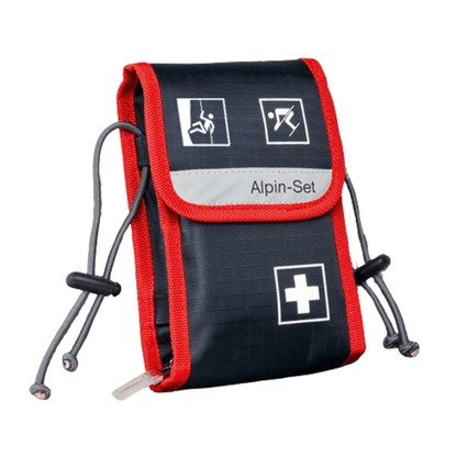 A compact first-aid kit in navy blue and red with white symbols depicting various emergency scenarios. The Holthaus Medical GmbH & Co. KG Alpin-Set First-Aid Kit—21-piece—bears the inscription “First-Aid Kit” and is equipped with adjustable drawstrings on both sides.