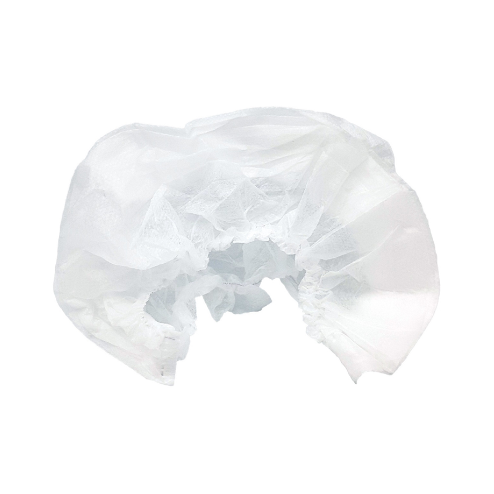 Ein zarter, weißer Brautschleier aus transparentem Stoff mit aufwendigen Spitzendetails und einem schützenden Gummizug, präsentiert auf einem schlichten weißen Hintergrund in der Packung (200 Stück) von Holthaus Medical mit Einweg-Kopfschutzhauben.