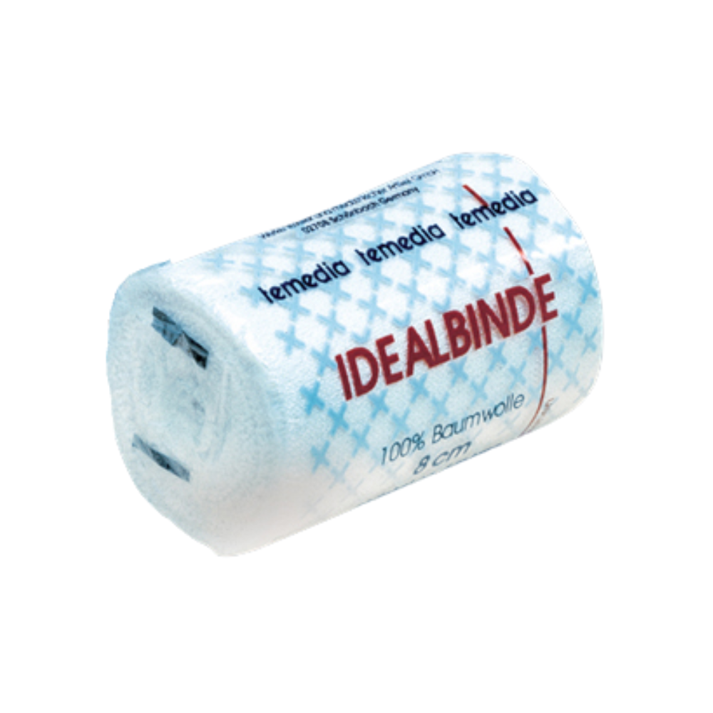 A rolled white gauze bandage with the inscription “Holthaus Temedia® Ideal Bandage, with bandage clip - 1 bandage” and red text. The packaging features a blue cross pattern and displays “100% cotton” and “8 cm”. The brand name “Holthaus Medical GmbH & Co. KG” is repeated at the top in blue.