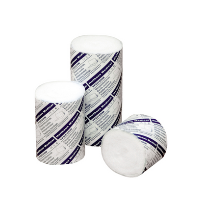 Shown are three cylindrical cotton rolls in partially opened white and blue packaging. Two rolls of Holthaus Ypsiform padding bandage from Holthaus Medical GmbH & Co. KG are standing upright, while one roll is lying on its side showing the white cotton end.