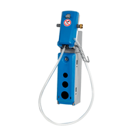 The Johannes Kiehl KG Kiehl DosiStation 1P-16 L Multidosing unit, designed for wall mounting and filling buckets or machines, features a coiled hose, round openings, and a no-smoking sign—perfect for dispensing cleaning agents in professional settings.