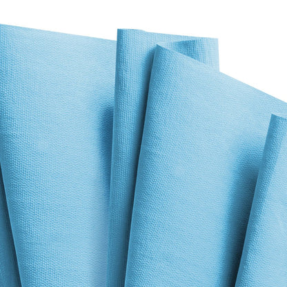 A close-up of several textured, steel blue WypAll® X80 PowerClean cleaning cloths (1 BRAG™ Box x 160 sheets) from Kimberly-Clark GmbH, overlapping and folded - perfect for industrial cleaning.