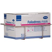 A Novocal stainless steel face mask box holder (for attachment to a Euro rail, 1 piece per package) holds a rectangular box labeled "Foliodress mask" that contains disposable face masks. Brand: Novocal.