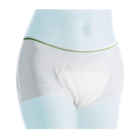 A pair of white, breathable Meditrade Light boxer shorts with a green-trimmed elastic waistband, displayed on a mannequin against a subtle blue background.