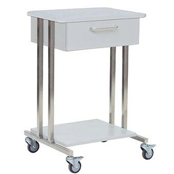 The Novocal System Trolley Modula 1 features a white metal frame, a single drawer with a handle, a lower shelf, and four 75-mm castors (two with brakes) for easy mobility. Suitable as a compact hospital trolley.