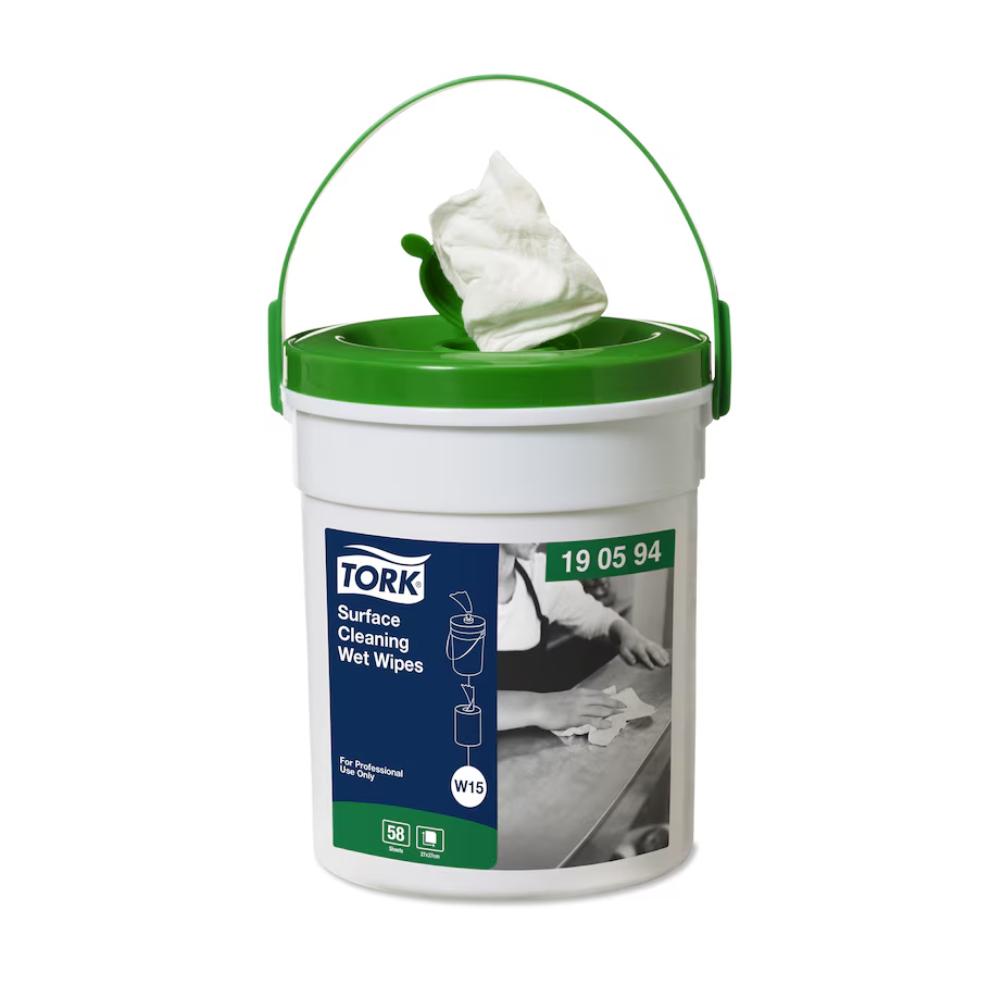 A green and white TORK - Essity Professional Hygiene Germany GmbH container with a handle holds the Tork 190594 wet surface cleaning wipes Premium W15 for efficient surface cleaning. A wipe protrudes from the lid, and the label features hands wiping a surface, with the inscription "For Professional" and "W15," indicating premium quality.