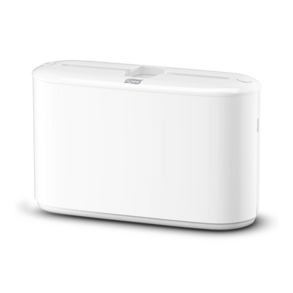 A white, rectangular electronic device with smooth edges and a flat top with a central slot, reflecting the elegant style of the Tork Xpress® 552200 Tabletop Dispenser for Multifold Hand Towels Elevation H2 from TORK – Essity Professional Hygiene Germany GmbH.