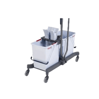 The Vileda GmbH Professional UltraSpeed Pro Double-Compartment Mop Bucket Set with High-Performance Wringing Mechanism includes a mop bucket with two compartments and is mounted on a frame with two upright handles. This set consists of a white bucket and a gray frame with rectangular compartments, a mop wringer, and four swivel casters for easy maneuverability.