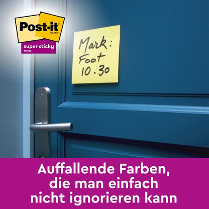 A 3M Deutschland GmbH Post-it® Super Sticky Notes Cube in Yellow (76 x 76 mm) with the handwritten note "Mark: Foot 10.30" sticks to a blue door above the handle; logo top left, German text below in purple.